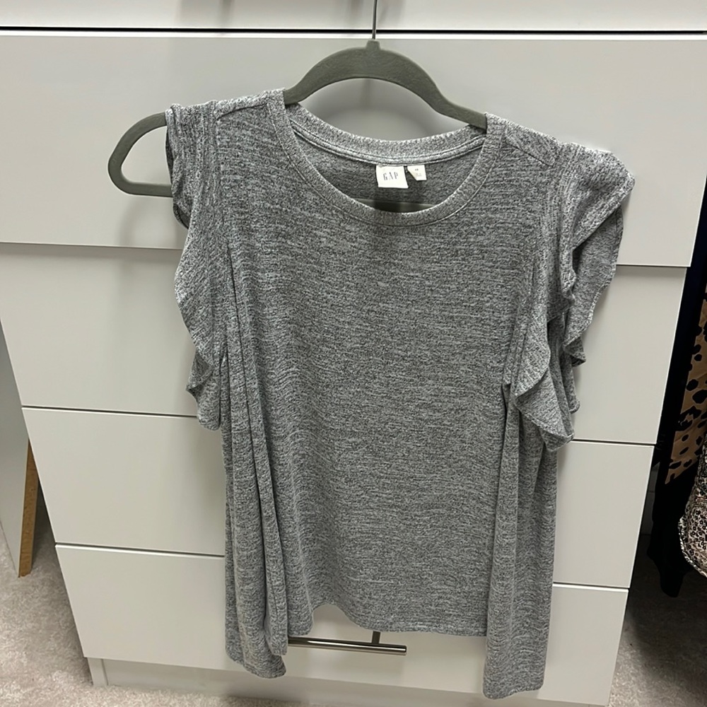 Grey lightweight sweater with cut out and ruffled shoulder